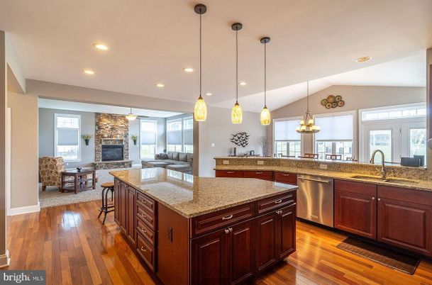 Fireplace, Interior, Kitchen, Living room, Pendant Lights, Recessed Lighting, Stainless Steel Appliances, Wood Texture Flooring