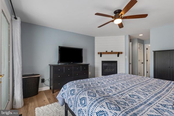 Bedroom, Fireplace, Interior, Recessed Lighting, Wood Texture Flooring