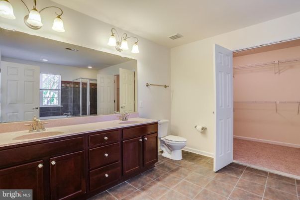 Bathroom, Dual Sink Vanities, Interior, Recessed Lighting, Walk-in Closets