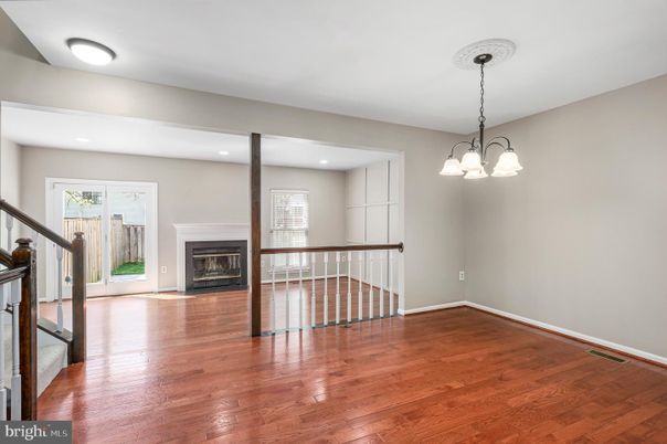 Chandelier, Empty room, Fireplace, Interior, Recessed Lighting, Wood Texture Flooring