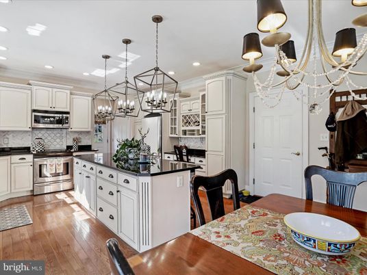 Chandelier, Interior, Kitchen, Pendant Lights, Recessed Lighting, Stainless Steel Appliances, Wood Texture Flooring