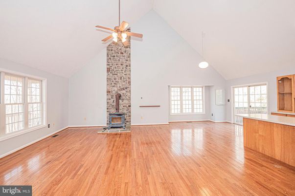 Empty room, Fireplace, Interior, Pendant Lights, Stone Walls, Wood Texture Flooring
