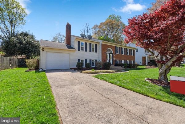 Attached, Backyard, Exterior, Facade, Brick Facade, Split Level