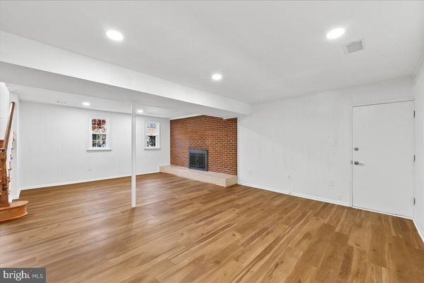 Empty room, Fireplace, Interior, Recessed Lighting, Stone Walls, Wood Texture Flooring