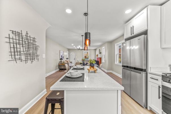 Dining room, Interior, Kitchen, Pendant Lights, Recessed Lighting, Stainless Steel Appliances, Wood Texture Flooring