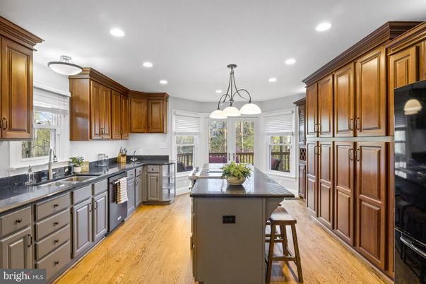 Chandelier, Interior, Kitchen, Pendant Lights, Recessed Lighting, Stainless Steel Appliances, Wood Texture Flooring
