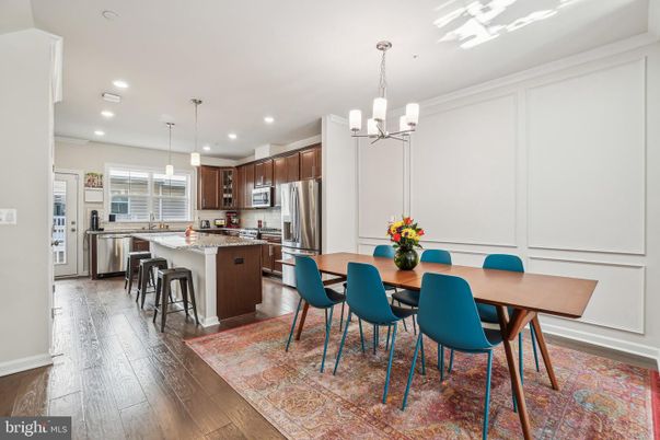 Chandelier, Dining room, Interior, Kitchen, Pendant Lights, Recessed Lighting, Stainless Steel Appliances, Wood Texture Flooring