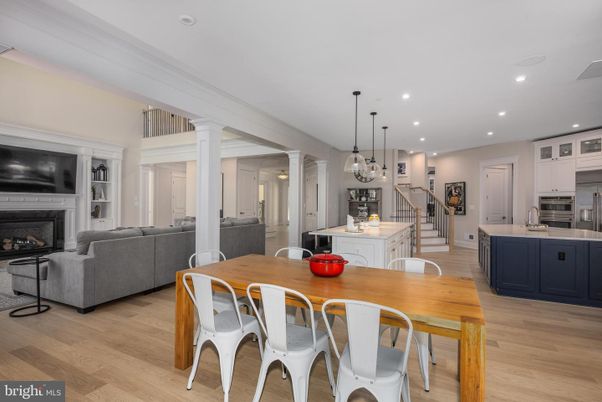 Dining room, Fireplace, Interior, Kitchen, Living room, Pendant Lights, Recessed Lighting, Stainless Steel Appliances, Wood Texture Flooring