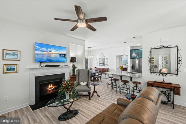 Dining room, Fireplace, Interior, Kitchen, Living room, Pendant Lights, Recessed Lighting, Stainless Steel Appliances, Wood Texture Flooring