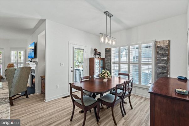 Dining room, Fireplace, Interior, Pendant Lights, Wood Texture Flooring