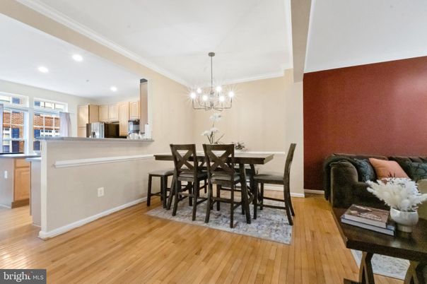 Chandelier, Dining room, Interior, Kitchen, Pendant Lights, Recessed Lighting, Stainless Steel Appliances, Wood Texture Flooring