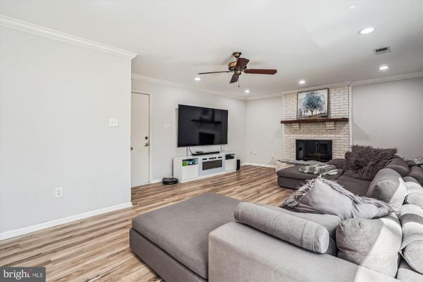 Fireplace, Interior, Living room, Recessed Lighting, Stone Walls, Wood Texture Flooring