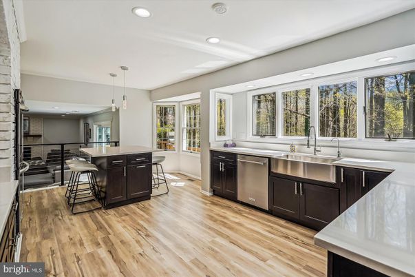 Dining room, Interior, Kitchen, Pendant Lights, Recessed Lighting, Stainless Steel Appliances, Stone Walls, Wood Texture Flooring