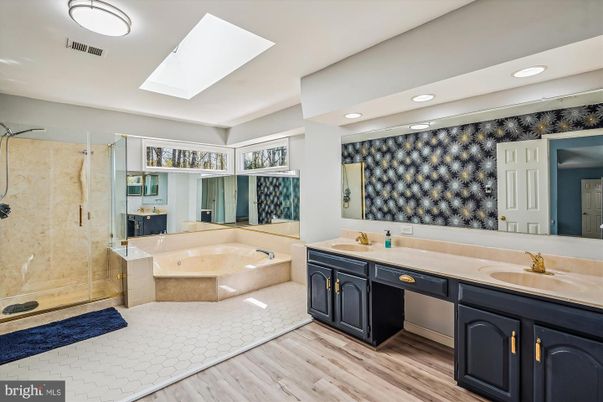 Bathroom, Dual Sink Vanities, Glass Shower, Interior, Recessed Lighting, Wood Texture Flooring