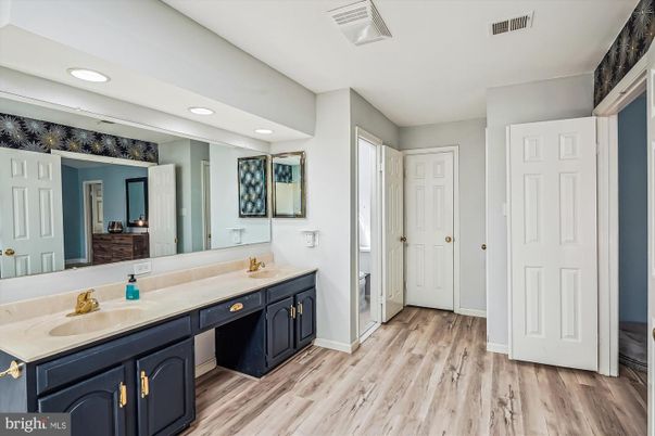 Bathroom, Dual Sink Vanities, Interior, Recessed Lighting, Wood Texture Flooring