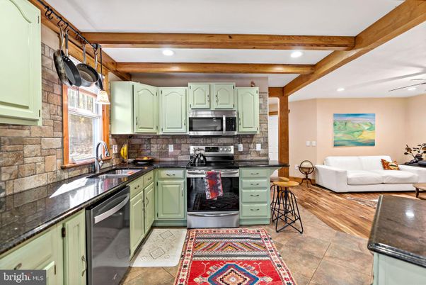 Interior, Kitchen, Living room, Recessed Lighting, Stainless Steel Appliances, Stone Walls, Wooden Beams, Wood Texture Flooring