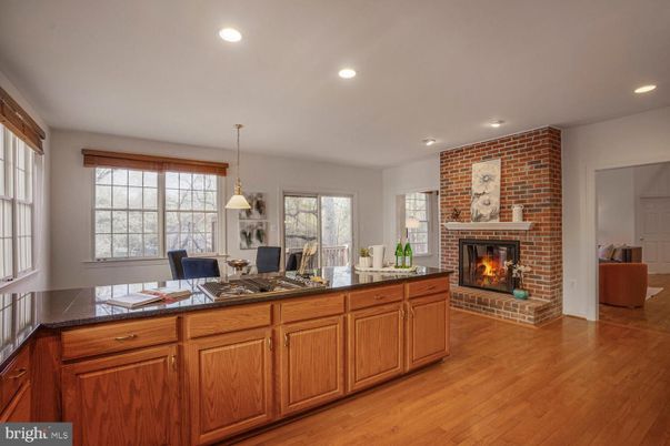 Dining room, Fireplace, Interior, Pendant Lights, Recessed Lighting, Stone Walls, Wood Texture Flooring