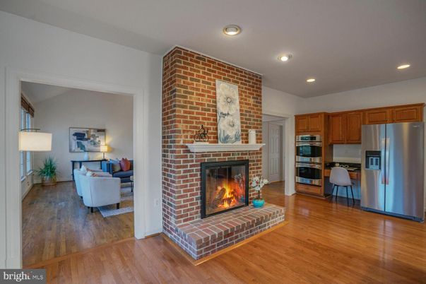 Fireplace, Interior, Kitchen, Living room, Recessed Lighting, Stainless Steel Appliances, Stone Walls, Wood Texture Flooring