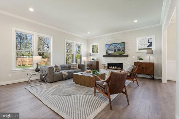 Fireplace, Interior, Living room, Recessed Lighting, Stone Walls, Wood Texture Flooring