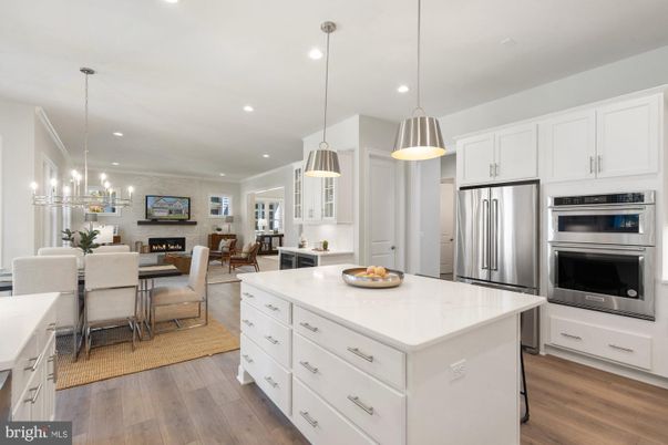 Dining room, Fireplace, Interior, Kitchen, Living room, Pendant Lights, Recessed Lighting, Stainless Steel Appliances, Wood Texture Flooring