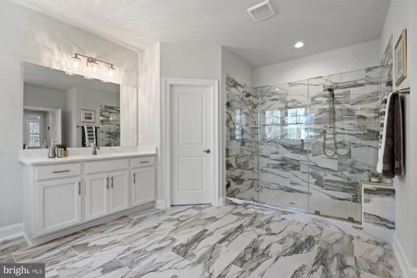 Bathroom, Dual Sink Vanities, Glass Shower, Interior, Marble, Marble Walls, Recessed Lighting