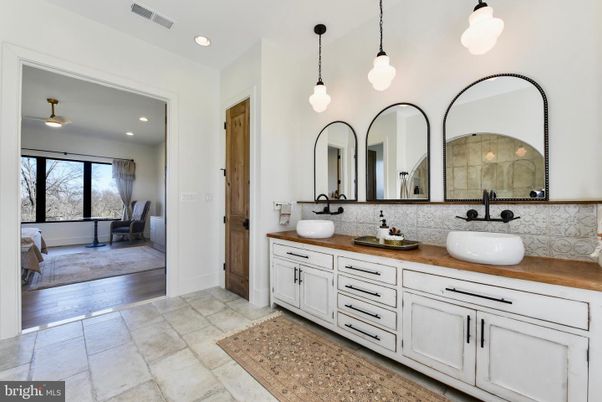 Bathroom, Dual Sink Vanities, Interior, Pendant Lights, Recessed Lighting, Wood Texture Flooring