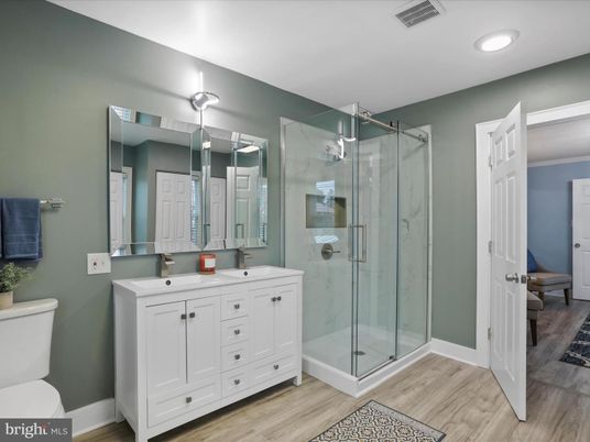 Bathroom, Dual Sink Vanities, Glass Shower, Interior, Recessed Lighting, Wood Texture Flooring