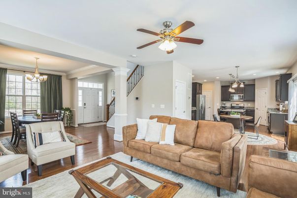 Chandelier, Dining room, Interior, Kitchen, Living room, Pendant Lights, Recessed Lighting, Stainless Steel Appliances, Wood Texture Flooring