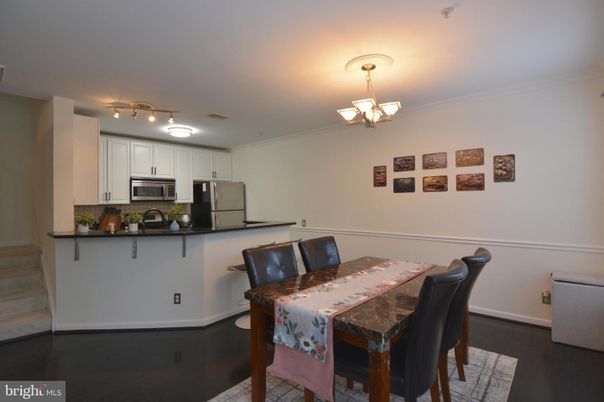 Chandelier, Dining room, Interior, Kitchen, Stainless Steel Appliances, Wood Texture Flooring
