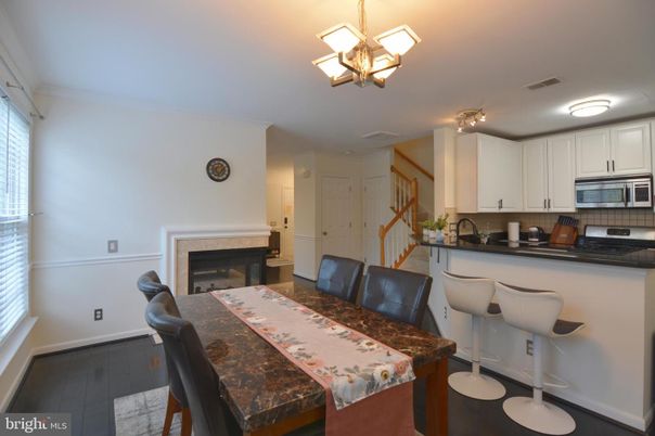 Chandelier, Dining room, Fireplace, Interior, Kitchen, Wood Texture Flooring