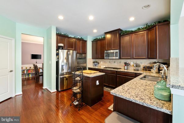 Dining room, Interior, Kitchen, Recessed Lighting, Stainless Steel Appliances, Wood Texture Flooring