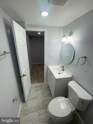 Bathroom, Dual Sink Vanities, Interior, Marble, Recessed Lighting, Wood Texture Flooring
