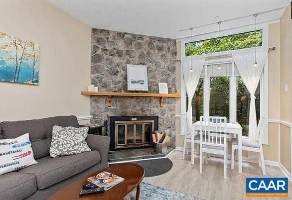 Dining room, Fireplace, Interior, Living room, Pendant Lights, Stone Walls, Wood Texture Flooring
