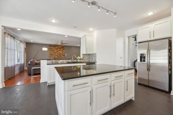 Interior, Kitchen, Recessed Lighting, Stainless Steel Appliances, Stone Walls, Wood Texture Flooring