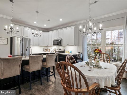 Chandelier, Dining room, Interior, Kitchen, Pendant Lights, Recessed Lighting, Stainless Steel Appliances, Wood Texture Flooring