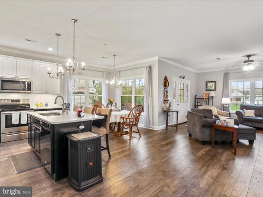 Chandelier, Dining room, Interior, Kitchen, Living room, Pendant Lights, Recessed Lighting, Stainless Steel Appliances, Wood Texture Flooring