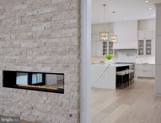 Fireplace, Interior, Kitchen, Marble Walls, Pendant Lights, Recessed Lighting, Stone Walls, Wood Texture Flooring