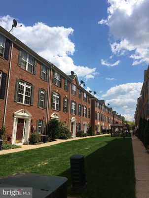 Backyard, Exterior, Facade, Brick Facade, Condo Building