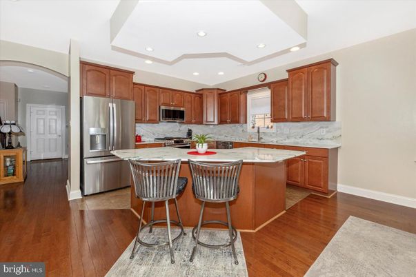Interior, Kitchen, Marble Walls, Recessed Lighting, Stainless Steel Appliances, Wood Texture Flooring