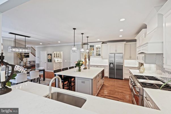 Chandelier, Dining room, Interior, Kitchen, Pendant Lights, Recessed Lighting, Stainless Steel Appliances, Wood Texture Flooring