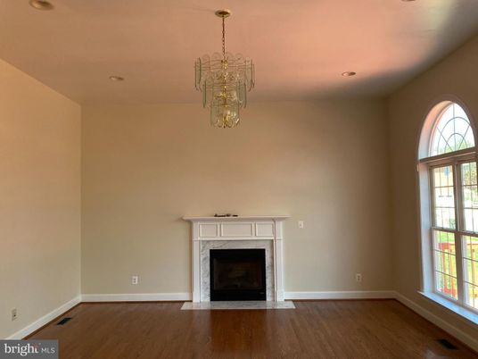 Chandelier, Empty room, Fireplace, Interior, Recessed Lighting, Wood Texture Flooring