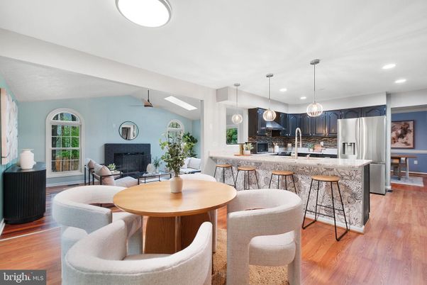 Dining room, Fireplace, Interior, Kitchen, Living room, Pendant Lights, Recessed Lighting, Stainless Steel Appliances, Wood Texture Flooring