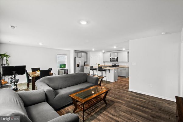 Dining room, Interior, Kitchen, Living room, Recessed Lighting, Stainless Steel Appliances, Wood Texture Flooring