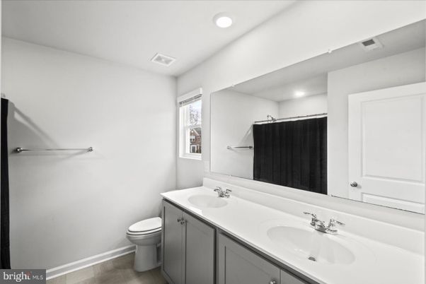 Bathroom, Dual Sink Vanities, Interior, Recessed Lighting, Wood Texture Flooring