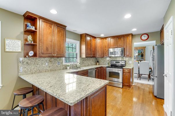 Dining room, Interior, Kitchen, Recessed Lighting, Stainless Steel Appliances, Wood Texture Flooring