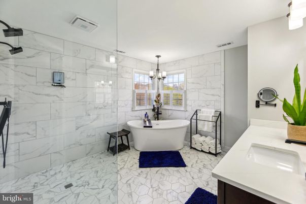 Bathroom, Dual Sink Vanities, Free Standing Baths, Glass Shower, Interior, Marble, Marble Walls, Pendant Lights