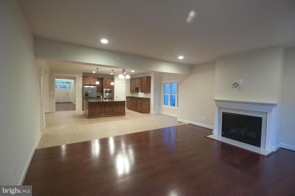 Empty room, Fireplace, Interior, Kitchen, Pendant Lights, Recessed Lighting, Wood Texture Flooring