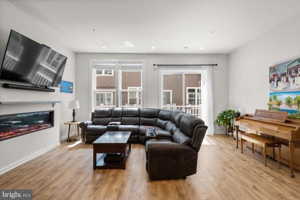 Fireplace, Interior, Living room, Piano, Recessed Lighting, Wood Texture Flooring
