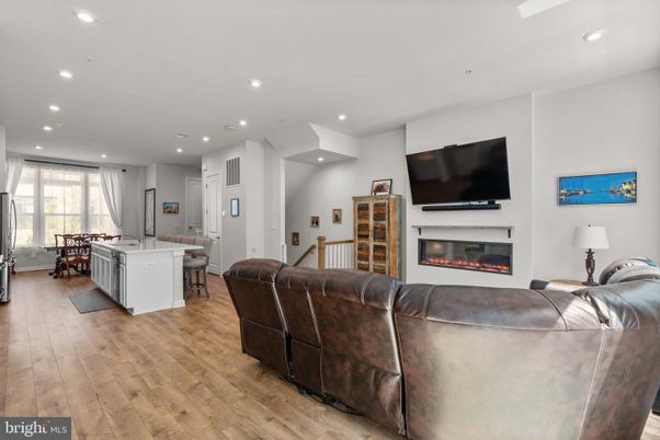Dining room, Fireplace, Interior, Kitchen, Living room, Recessed Lighting, Wood Texture Flooring
