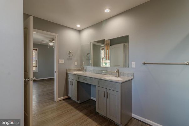 Bathroom, Dual Sink Vanities, Interior, Recessed Lighting, Wood Texture Flooring
